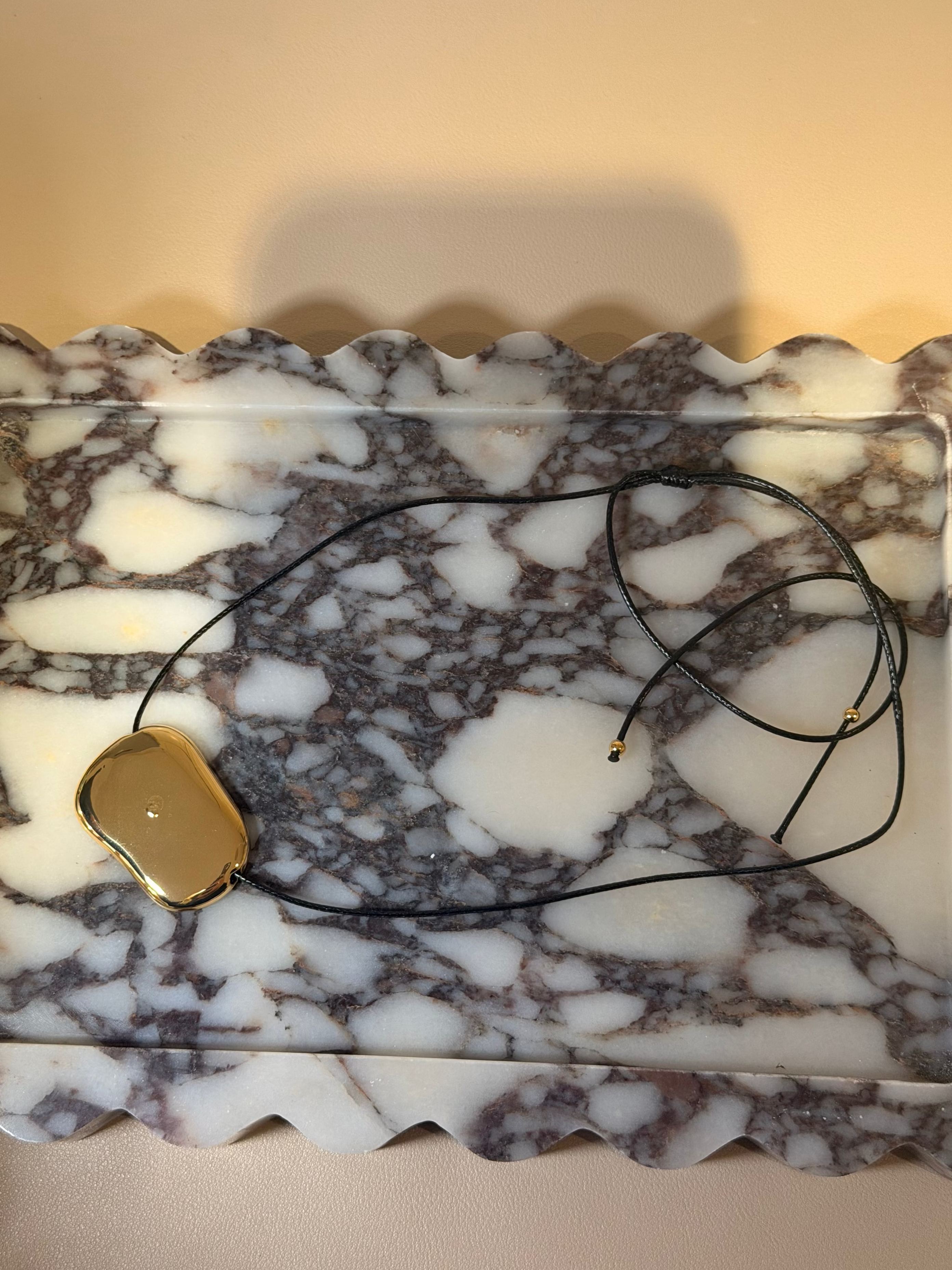 Gold Abstract Pendant on Black Rope